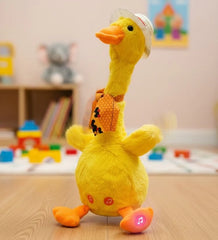 Yellow plush duck toy with a helmet on a wooden surface in a room with toys and books.